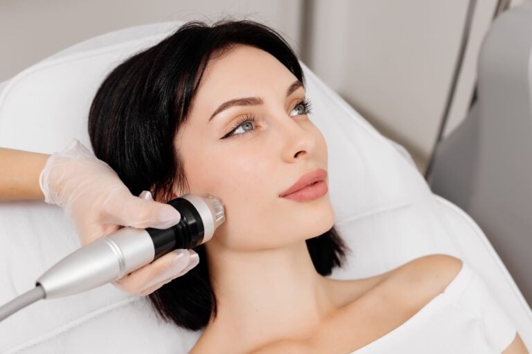 A serene woman receiving an RF Microneedling treatment at Premiere Concierge & Wellness, showcasing the precision and effectiveness of this rejuvenating skincare procedure for smoother, firmer skin.